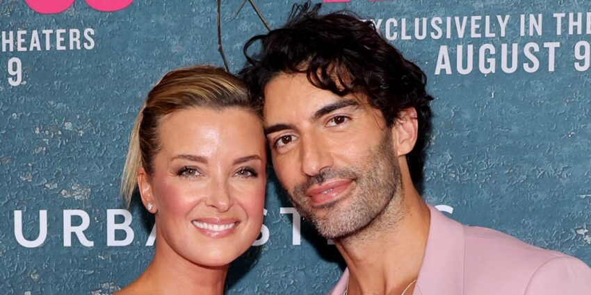Justin and Emily Baldoni posing on a red carpet