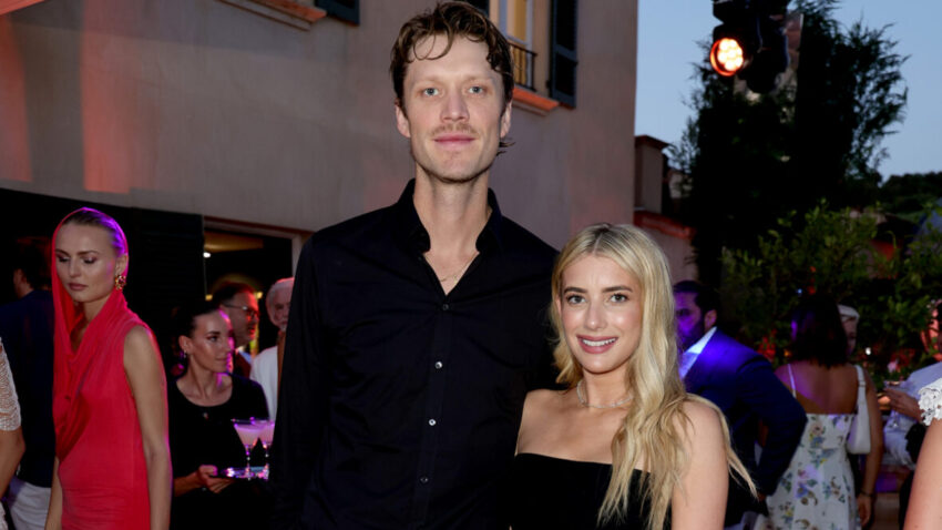 Emma Roberts and Cody John in black posing together