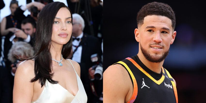 Irina Shayk on the left, Devin Booker on the right. Irina is in a white dress with her hair down, looking off with a crowd of photographers behind her. Devin is in his NBA jersey with a slight smile